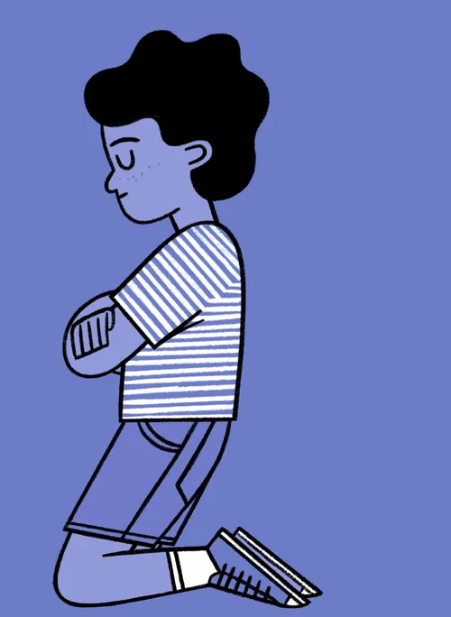 A boy kneeling in prayer