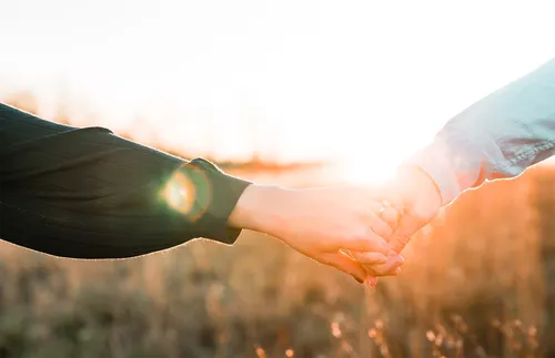 two people holding hands