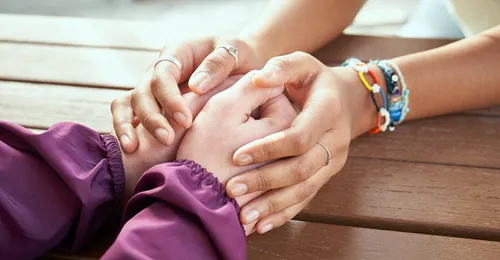 holding hands in comfort