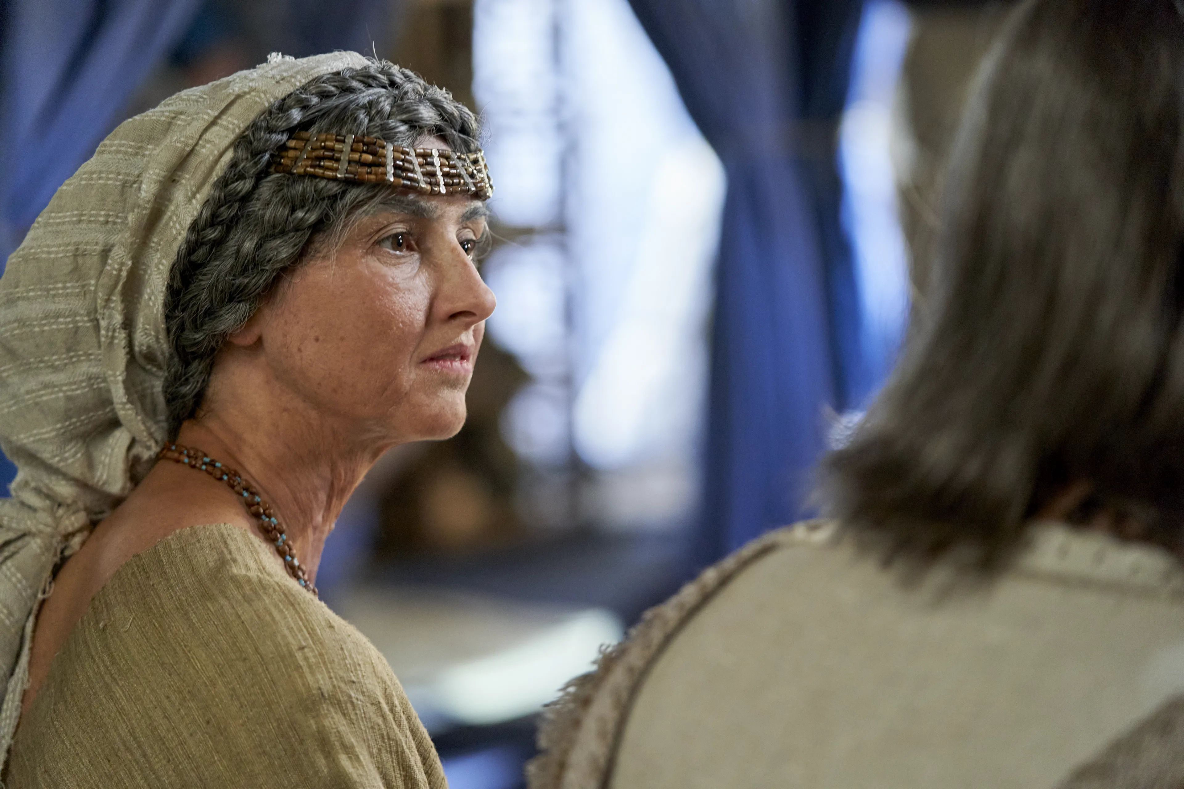 The wife of Alma the Elder sits and talks with her husband.