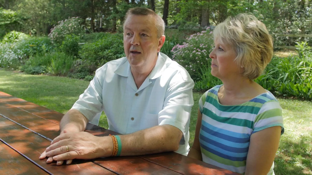 A married couple at a picnic table