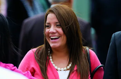 A woman laughing at the April 2011 General Conference.