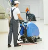 man cleaning floor