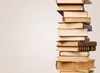 arrow pointing at the top of pile of books