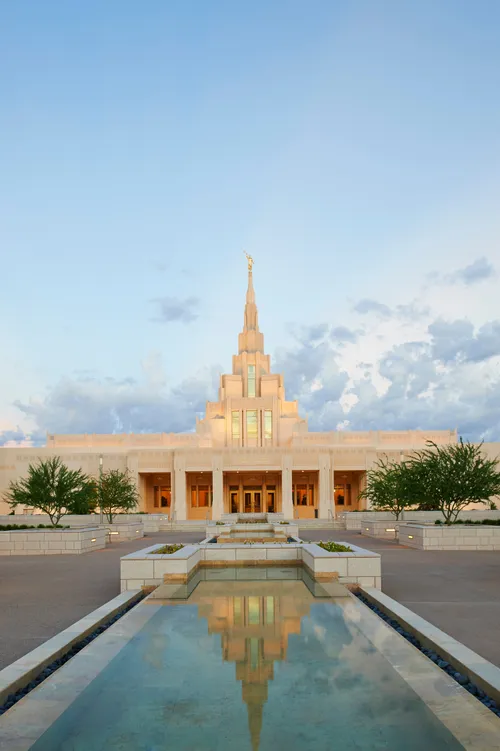 The Phoenix Arizona Temple entrance during sunset, including scenery and the water fountain.