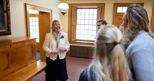 visitors inside Beehive House