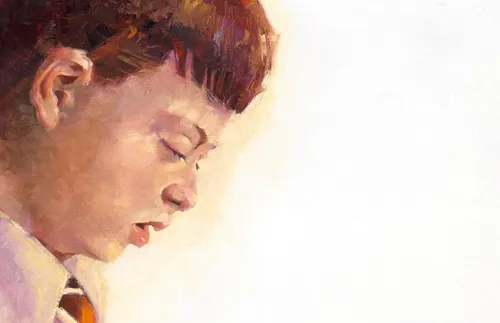 young man with Down syndrome and with head bowed