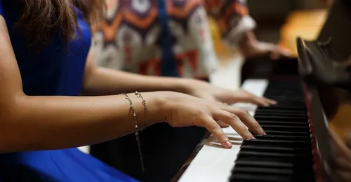 young woman playing piano