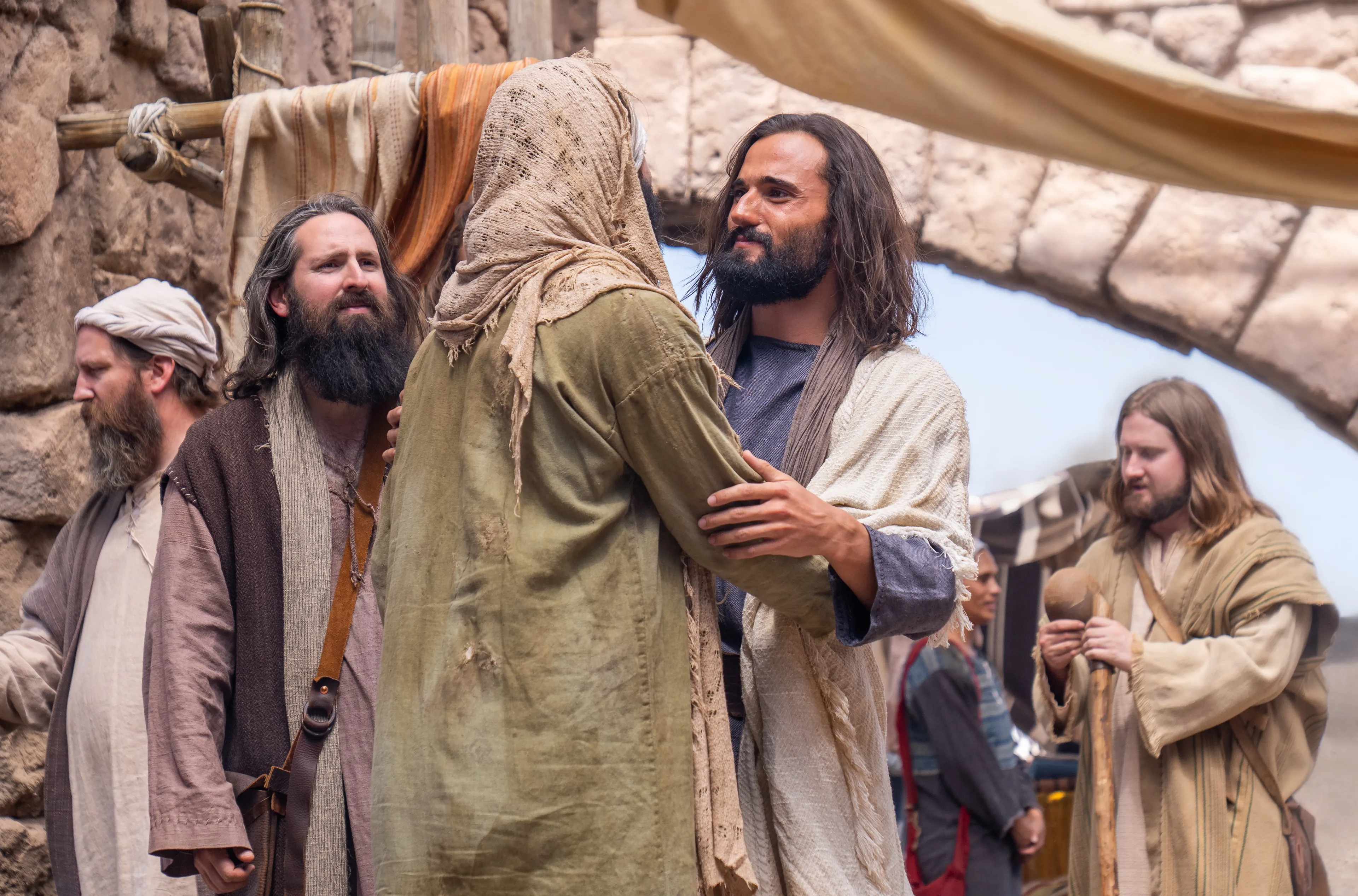 Jesus Christ greets a blind man.