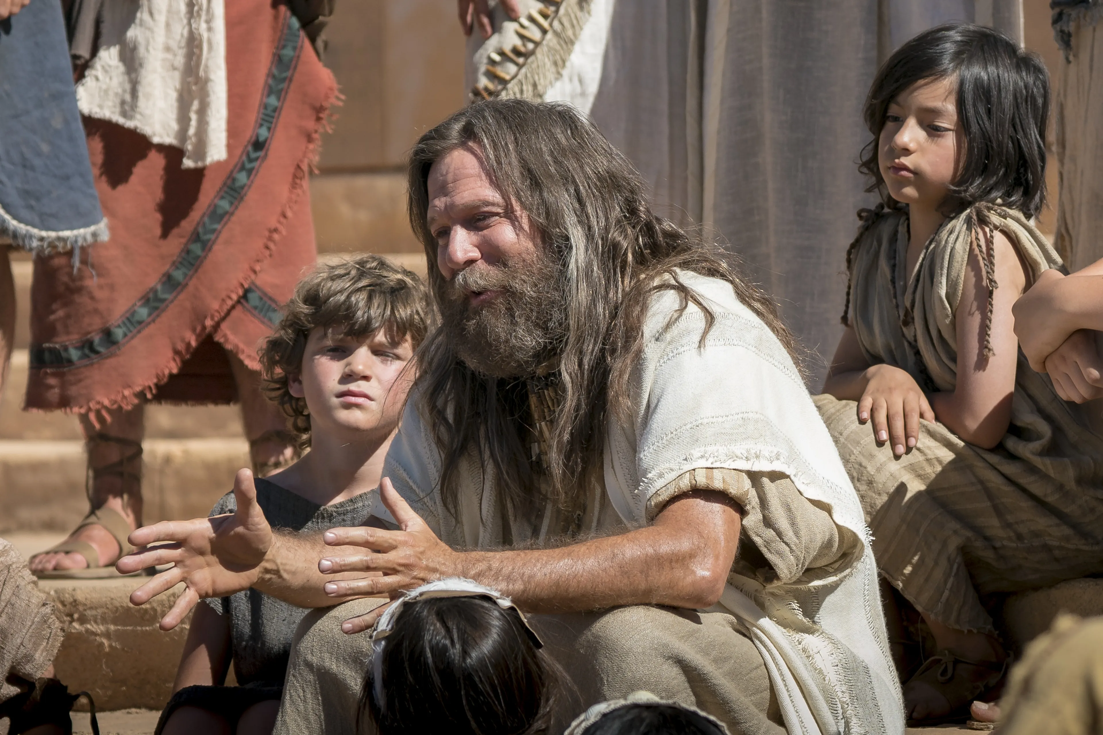 Jacob sits on the steps of the temple as he teaches the Nephites.
