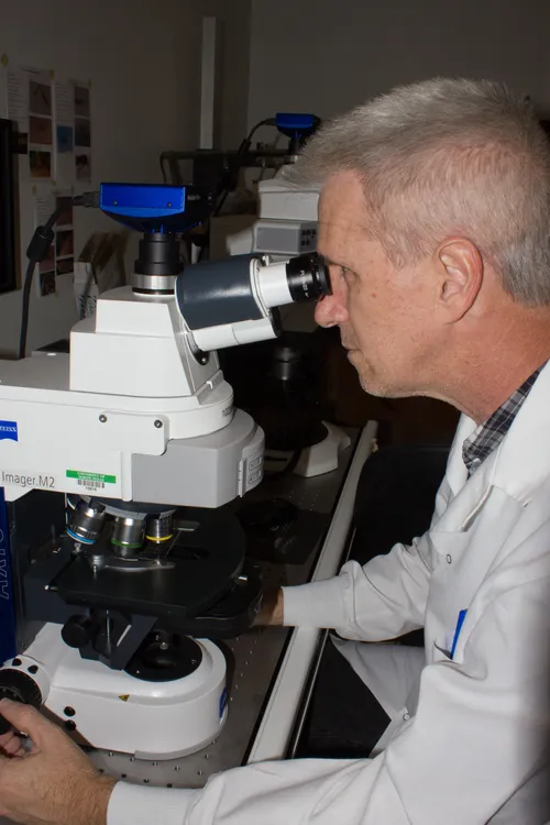 scientist with microscope