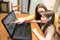 mom and daughter look at Family Search on laptop