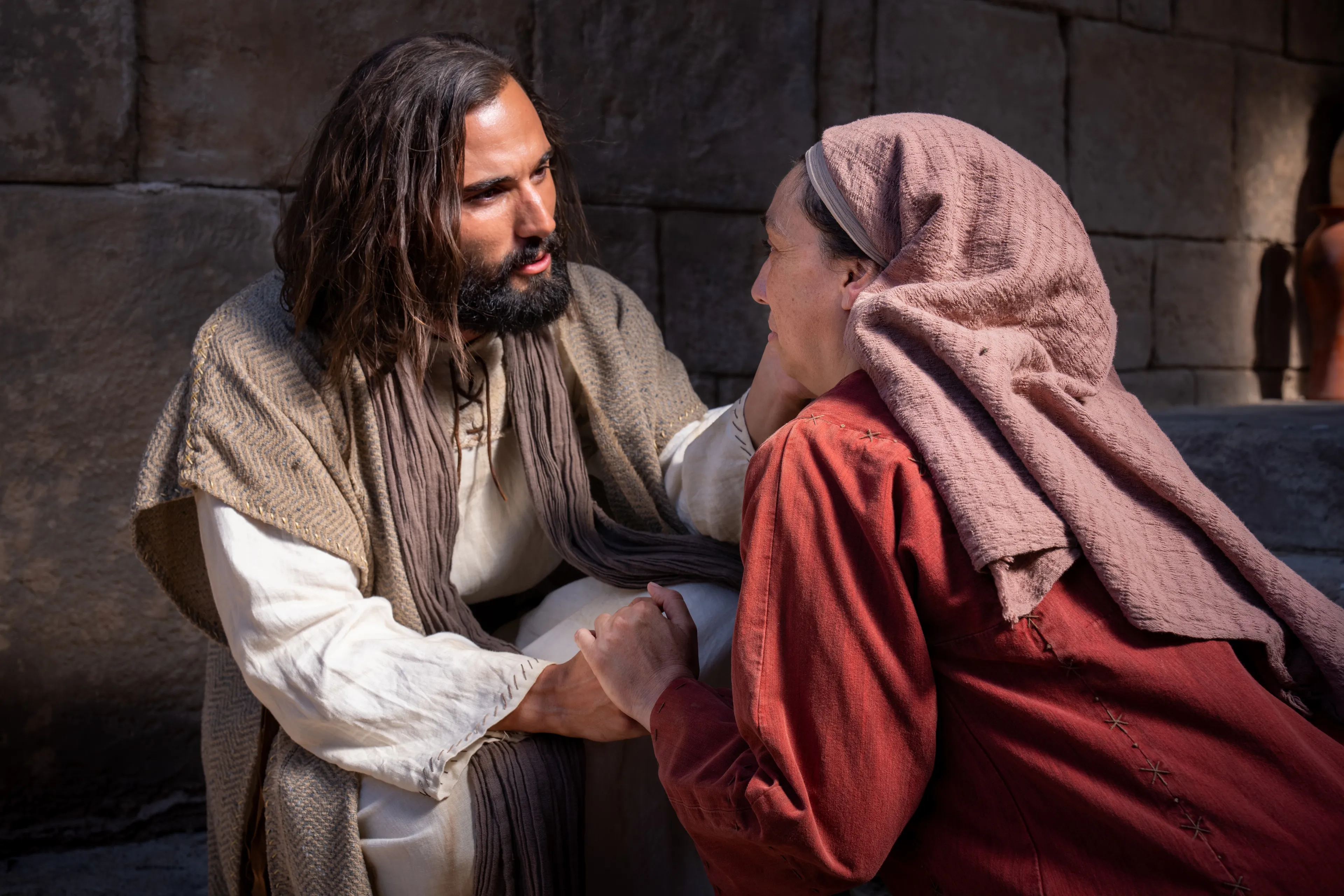Jesus heals a woman with an issue of blood.