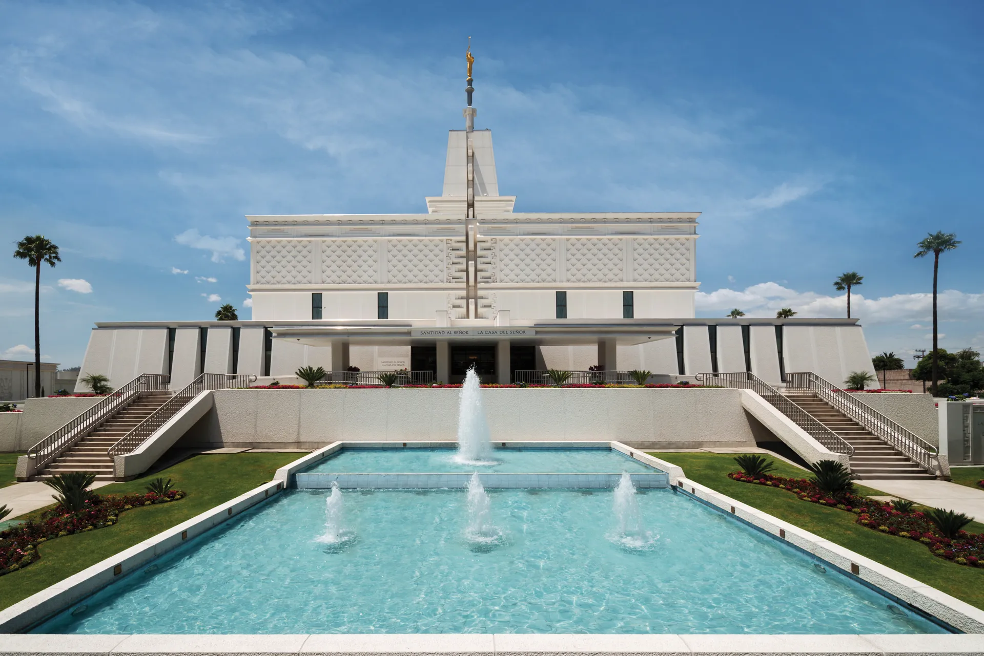 The front of the Mexico City Mexico Temple in the daytime, including the water feature near the entrance.
