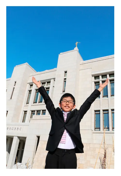 boy standing in front of temple