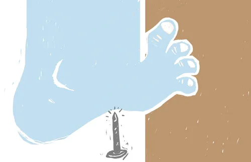 foot stepping on nail