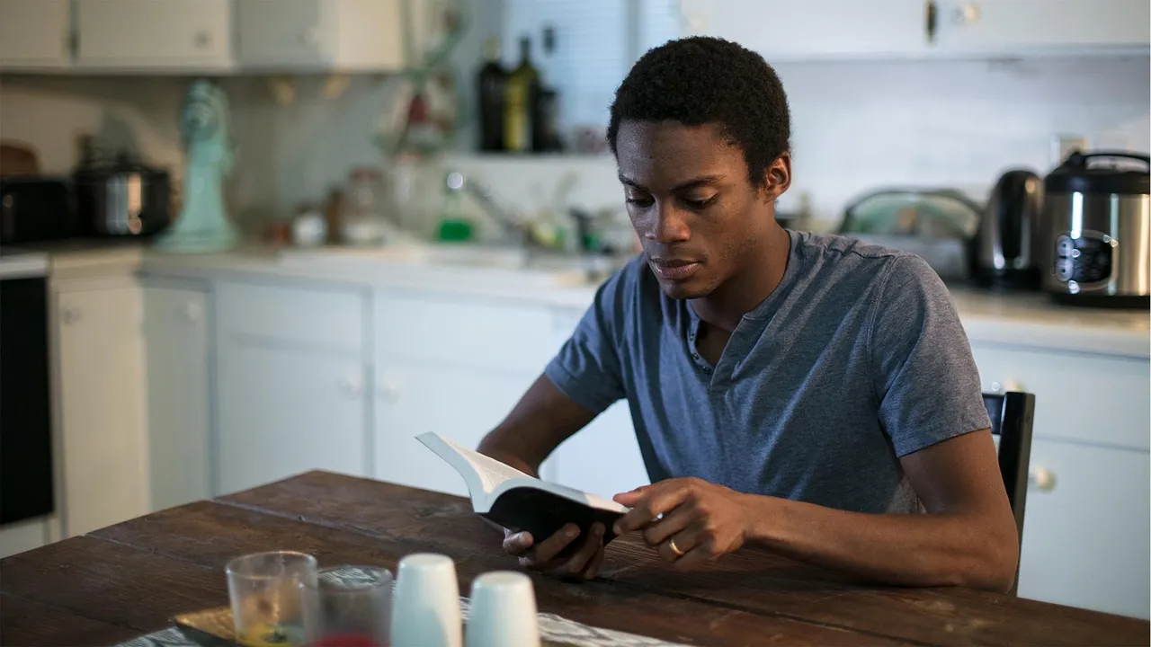 Shaquille sits at his kitchen table explains how the Book of Mormon helps his life and brings him closer to Jesus Christ