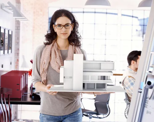 Woman holds her architectural model