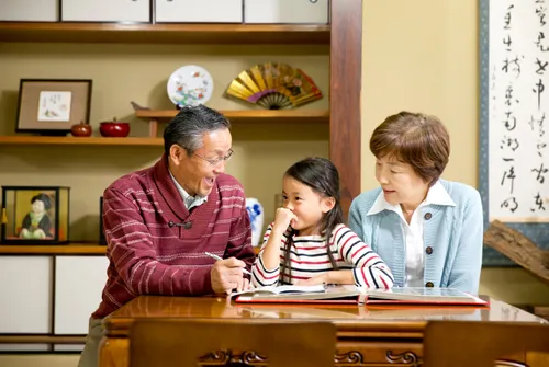 girl sitting with grandparents