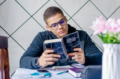 young man reading the Bible