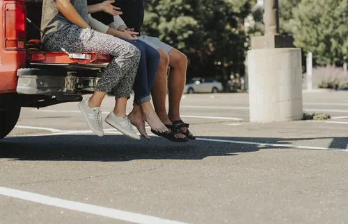 sitting on the back of a truck
