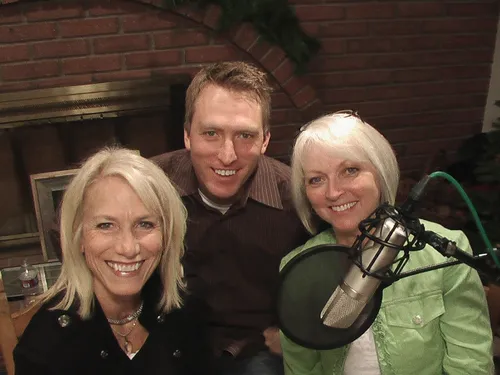 The Rasmussen family beside a radio microphone.