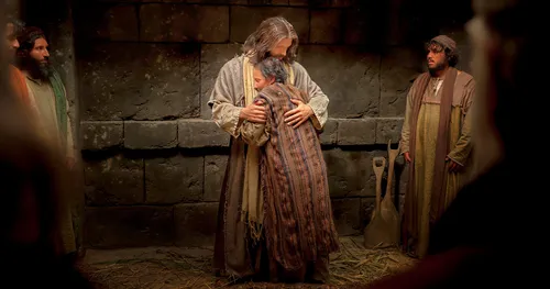 a person embracing Christ after being healed