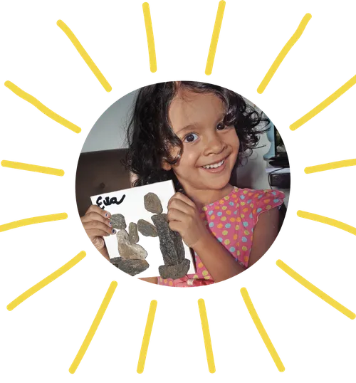 girl holding rock art