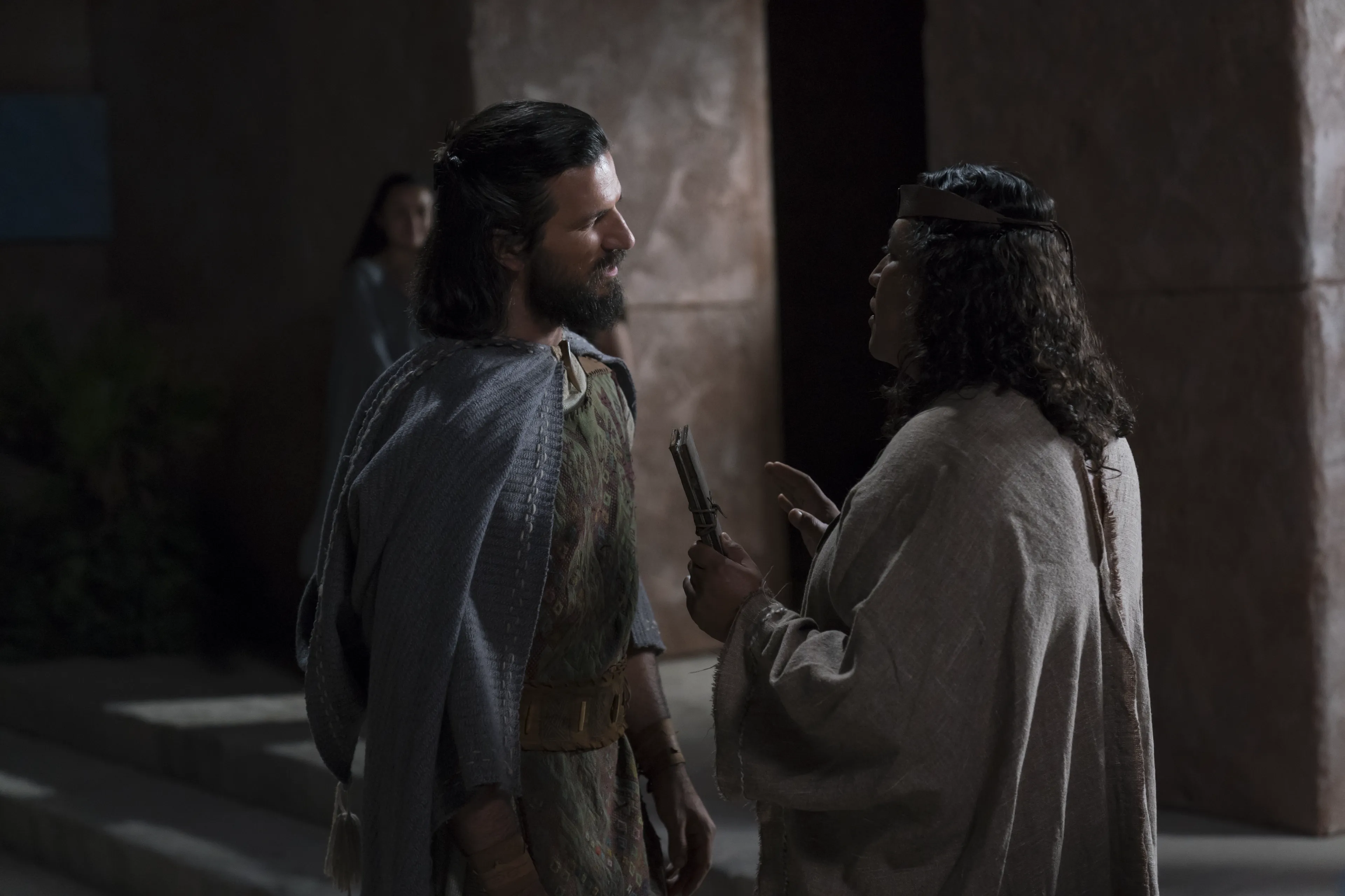 Alma the Younger speaks with a priest.