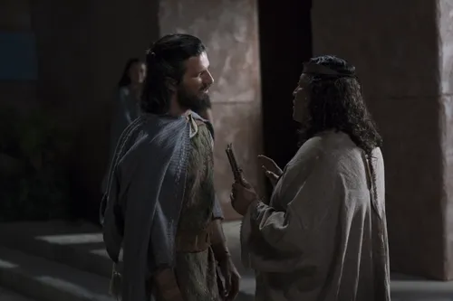 Alma the Younger speaks with a priest.