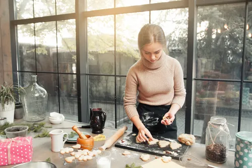 Young adult making cookies