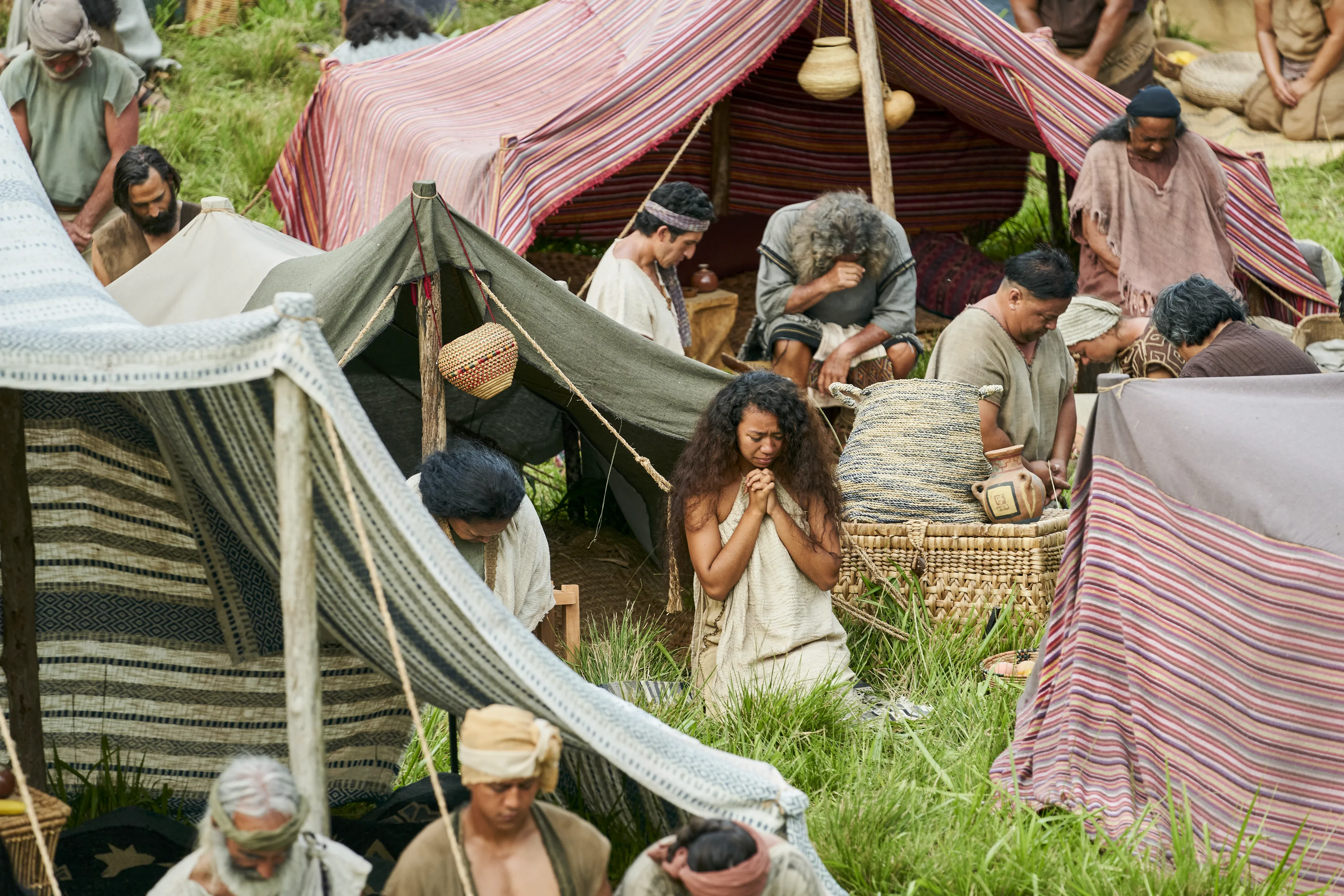 Men and women gather to listen to King Benjamin in the Land of Zarahemla.
