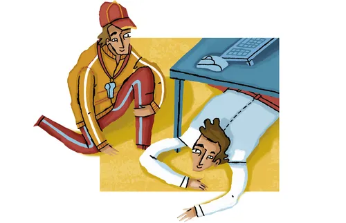 coach kneeling by man lying on ground