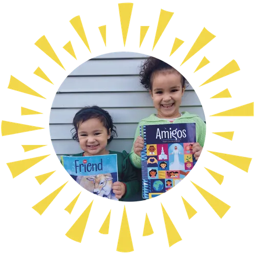 two girls holding Friend magazine in Spanish and English