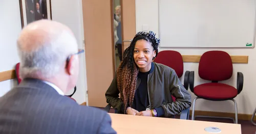 young woman meets with her Bishop