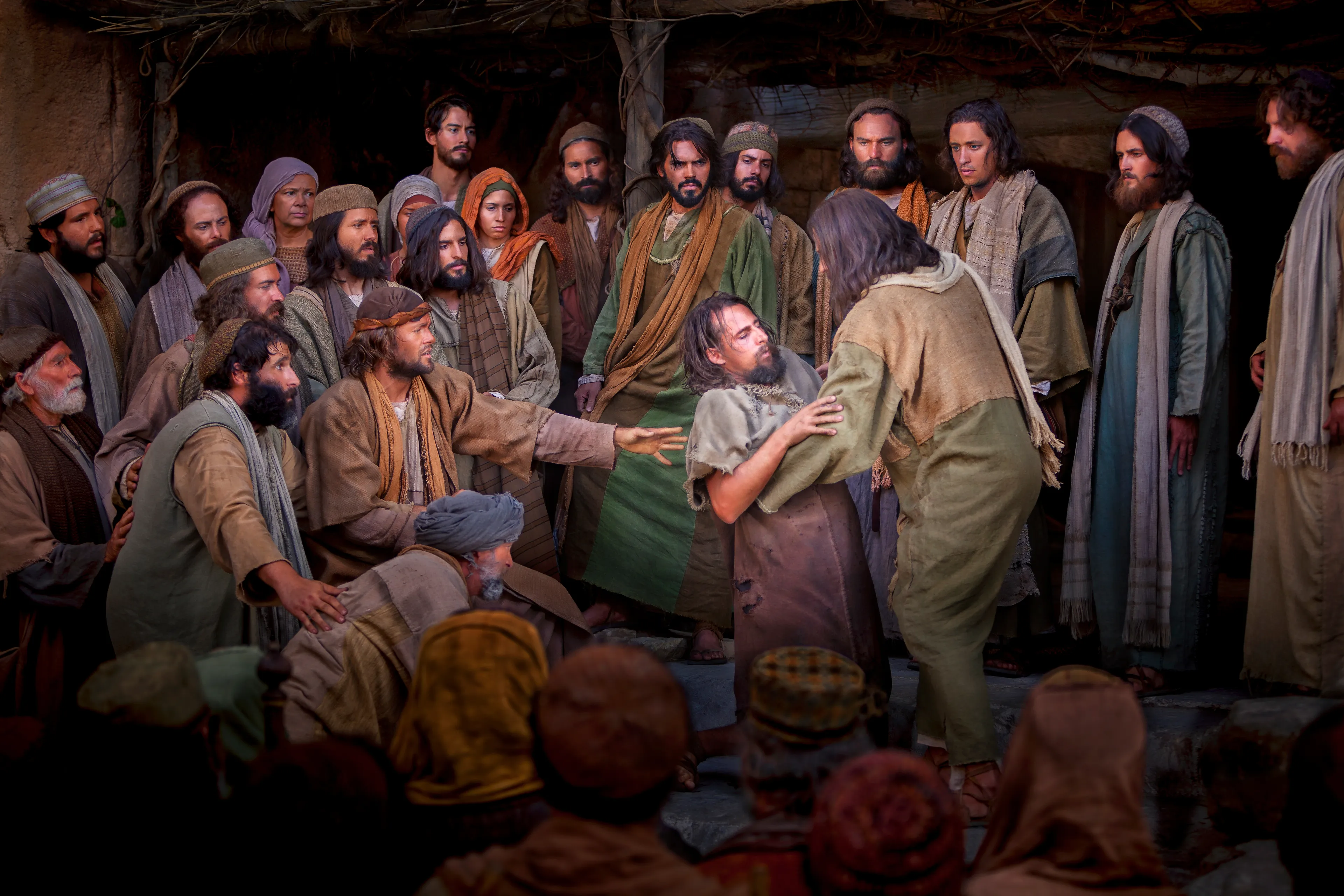 Christ healing a man who then tries to stand.