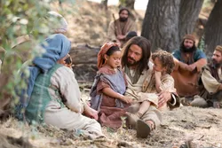 Jesus Christ sits with his disciples teaching them that we all must become as little children