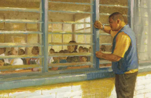 man looking in a window