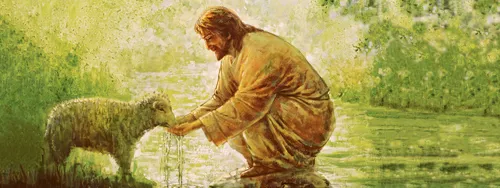 Jesus Christ stooping down and feeding a small lamb in a meadow