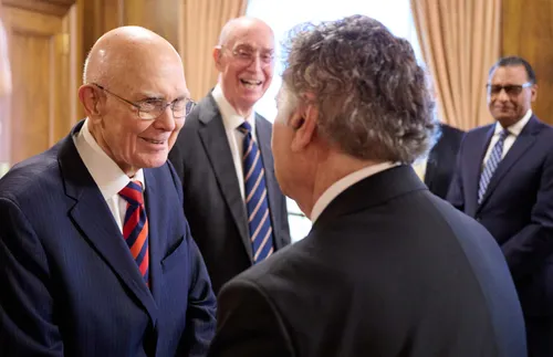 First Presidency members greeting leaders from New York