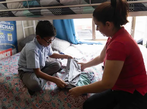 Boy helping his mom do chores
