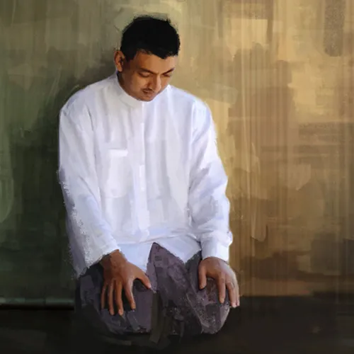 a young man kneeling and praying