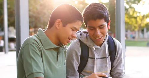 two young men talking with each other