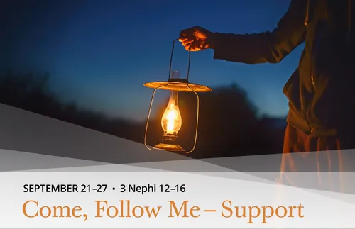 man holding a lantern