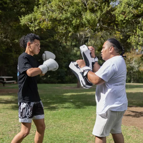 Cassidy practicing kickboxing with his son