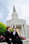 two brothers sitting outside Houston Temple