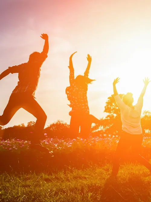 Young adults jumping