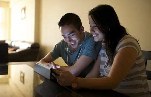 couple looking at tablet