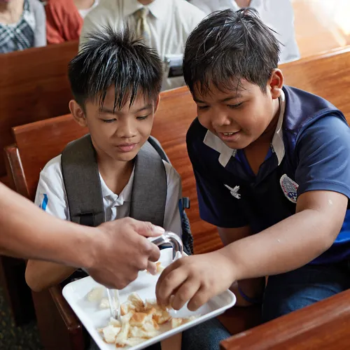 young men taking sacrament
