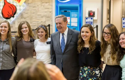 President Holland with a group of sister missionaries